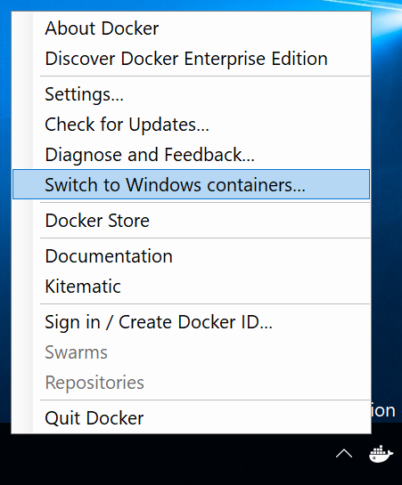 Screenshot of the Docker system tray menu. The Switch to Windows containers command is selected.