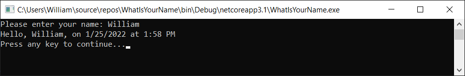 Capture d’écran montrant la fenêtre de console de débogage avec « Entrez votre nom », la date et l’heure, et « Appuyez sur n’importe quelle touche pour continuer ».